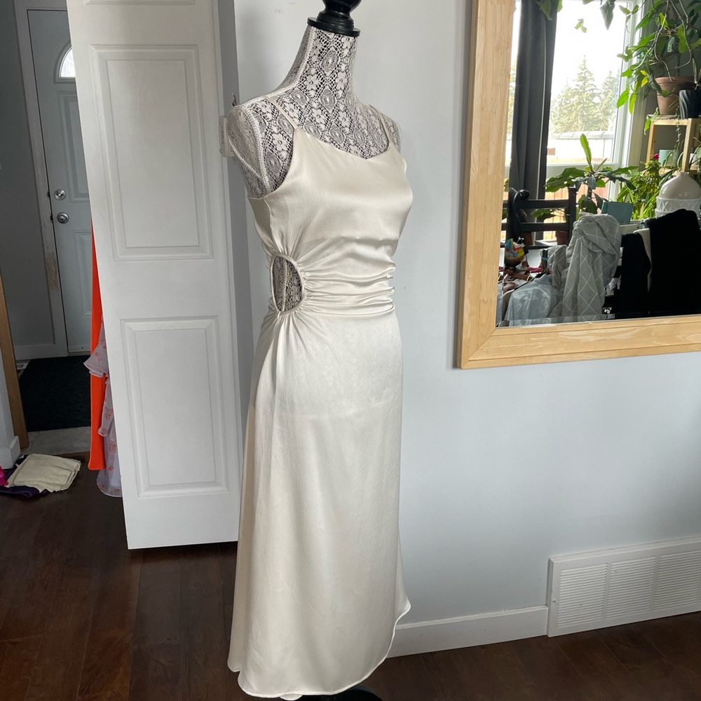 Pretty Dress With Side Cut Outs. Ivory/Cream.